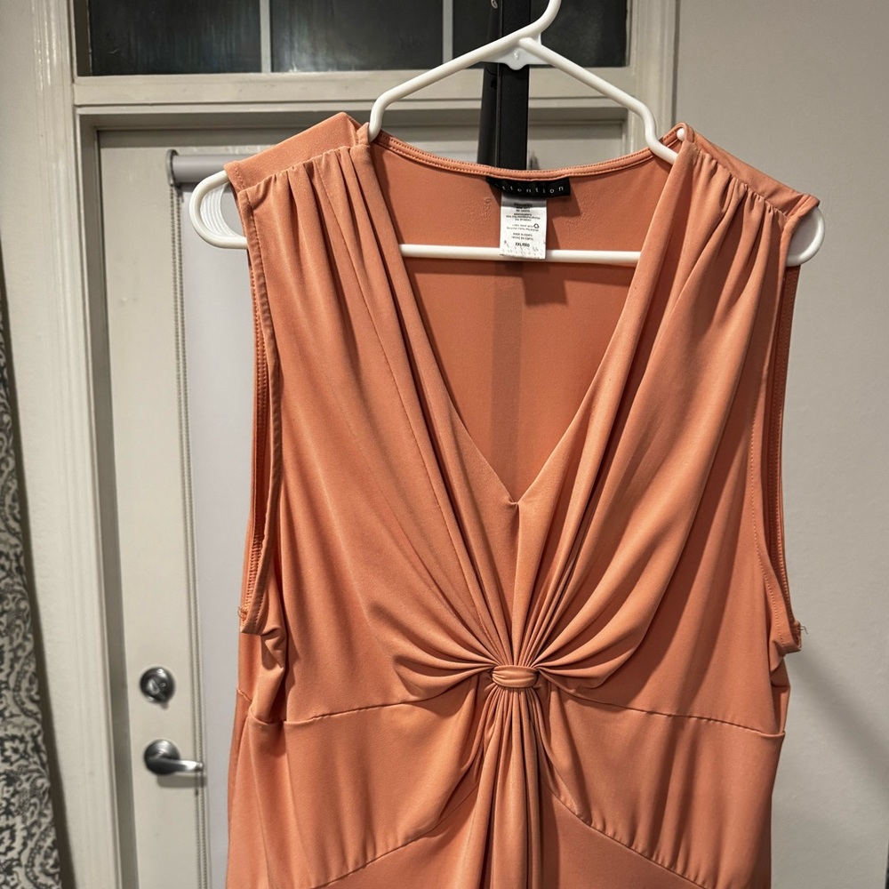 Dressy tank in a peachy color. Size XXL, low cut will show cleavage